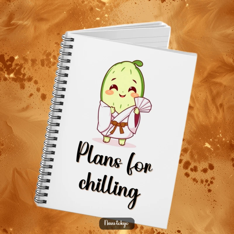 Funny cucumber slice in a white kimono fanning itself, on the cover of a lined notebook for all your notes.